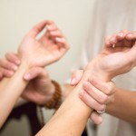 office and home visits: Heather Baines reading pulse during an Ayurveda health assessment